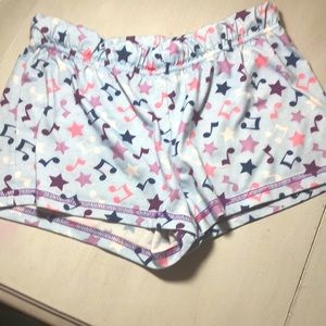 Stretchy pajama shorts with a music note design